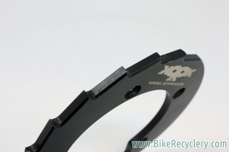 Kooka Crankcase Sawtooth Bash Guard: 36t, 110mm 5-Bolt, Black Anodized, 1990's