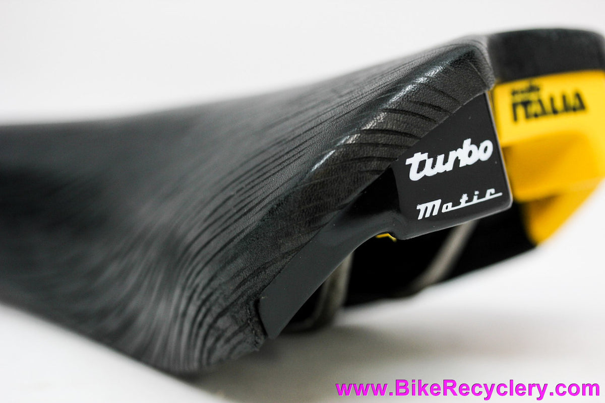 NIB/NOS Selle Italia Turbo-Matic Saddle: 1991 Vintage - Black Textured Leather - Yellow/Black Accents (Take-off)