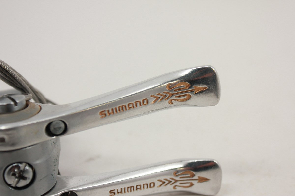 NOS Shimano 105 Golden Arrow Downtube Shifters: SL-A105, Clamp-on, w/Cable Clips & Cables